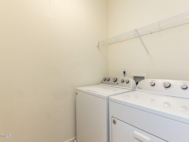 112 Churment Ct, Durham, NC 27703 - laundry room featuring washing machine and dryer and baseboards