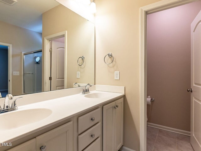 112 Churment Ct, Durham, NC 27703 - bathroom featuring double vanity and tile patterned floors
