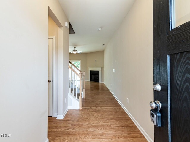 112 Churment Ct, Durham, NC 27703 - hall featuring light wood finished floors and stairway