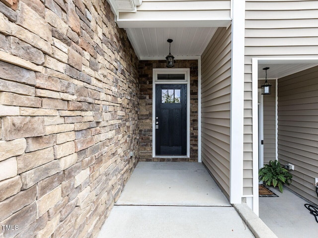 112 Churment Ct, Durham, NC 27703 - view of exterior entry featuring stone siding