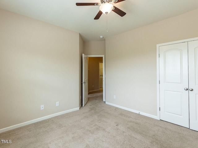 112 Churment Ct, Durham, NC 27703 - unfurnished bedroom with carpet, a closet, and a ceiling fan