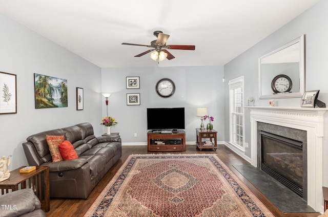 6020 Jones Farm Rd, Wake Forest, NC 27587 - living room with dark wood-style floors, ceiling fan, a fireplace, and baseboards