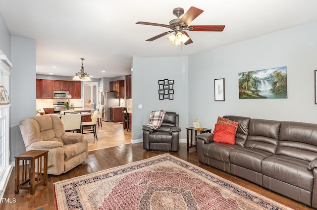 6020 Jones Farm Rd, Wake Forest, NC 27587 - living room featuring a ceiling fan, light wood finished floors, recessed lighting, a chandelier, and baseboards