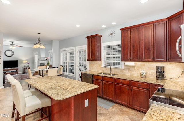 6020 Jones Farm Rd, Wake Forest, NC 27587 - kitchen featuring a sink, reddish brown cabinets, a ceiling fan, stainless steel appliances, and recessed lighting