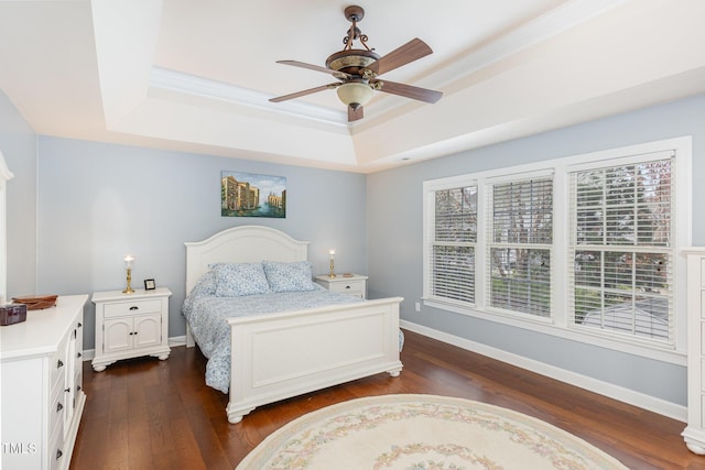 6020 Jones Farm Rd, Wake Forest, NC 27587 - bedroom featuring a tray ceiling, dark wood-style flooring, baseboards, crown molding, and ceiling fan