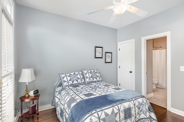6020 Jones Farm Rd, Wake Forest, NC 27587 - bedroom with wood finished floors, ensuite bath, baseboards, and ceiling fan