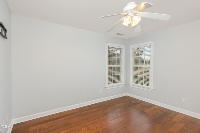 6020 Jones Farm Rd, Wake Forest, NC 27587 - empty room featuring dark wood-type flooring, baseboards, and a ceiling fan