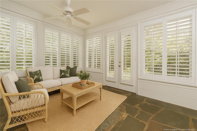 sunroom / solarium featuring french doors