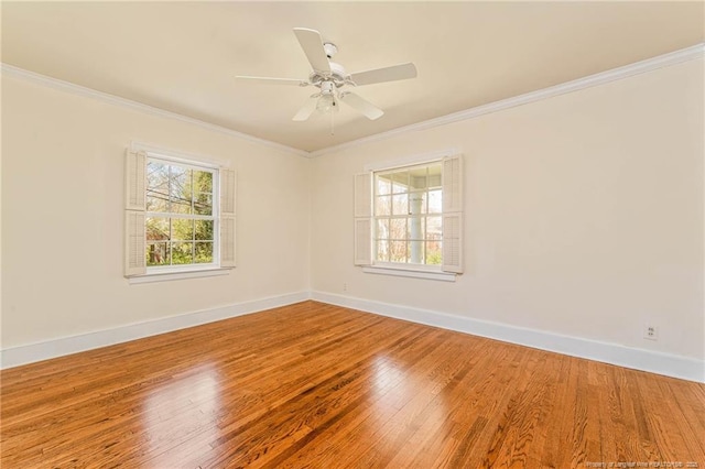 unfurnished room with baseboards, ornamental molding, light wood finished floors, and ceiling fan