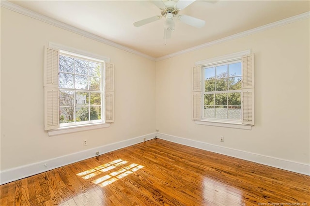 unfurnished room featuring wood finished floors, baseboards, a ceiling fan, and ornamental molding