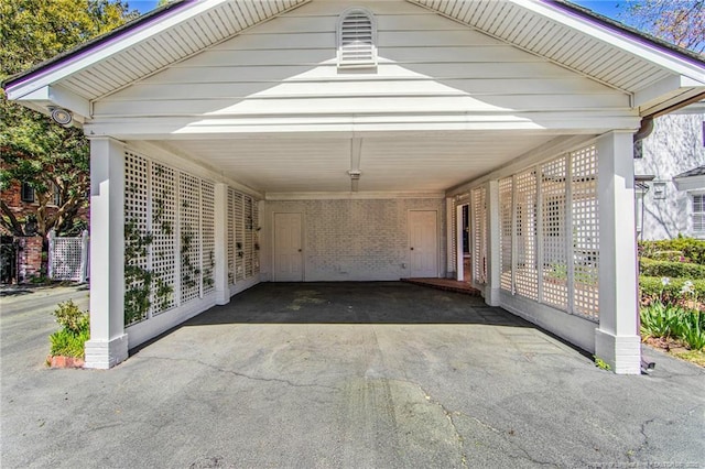 view of vehicle parking with a carport