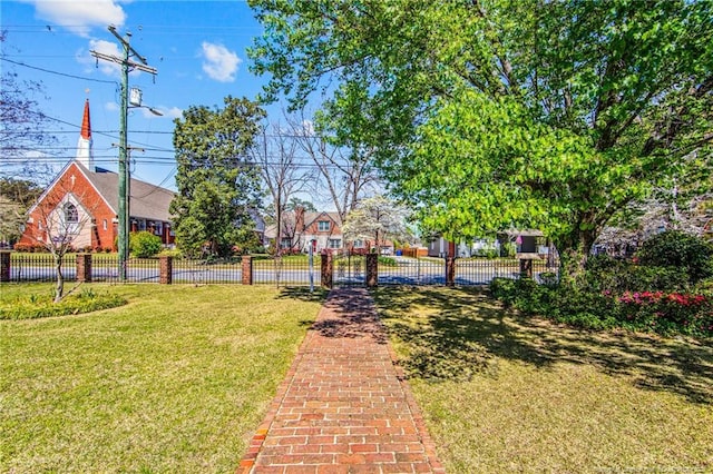surrounding community with a yard and fence