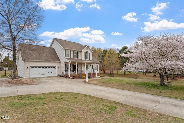 15 Longwood Dr, Youngsville, NC 27596 - view of front of property featuring covered porch, a front yard, concrete driveway, and a garage