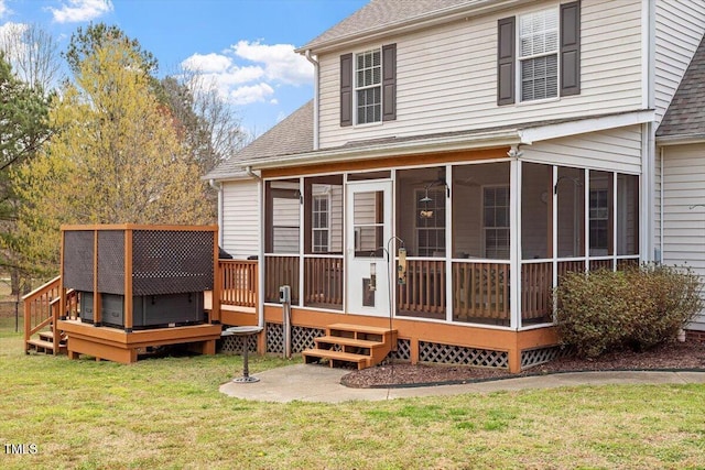 15 Longwood Dr, Youngsville, NC 27596 - rear view of house featuring a wooden deck, a sunroom, a shingled roof, and a lawn