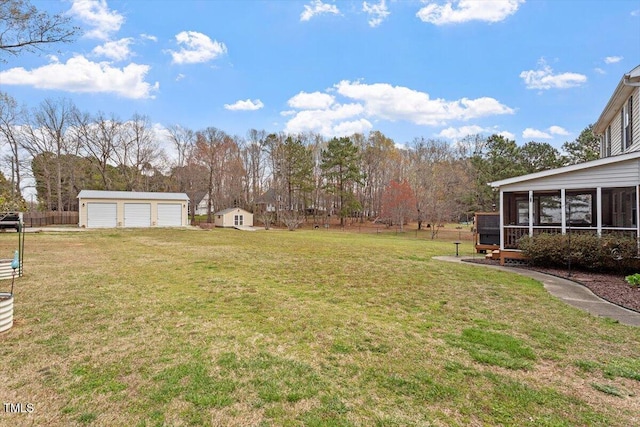 15 Longwood Dr, Youngsville, NC 27596 - view of yard featuring an outbuilding, a sunroom, and a detached garage