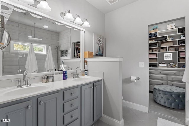 15 Longwood Dr, Youngsville, NC 27596 - full bathroom with double vanity, a sink, a tile shower, and tile patterned flooring