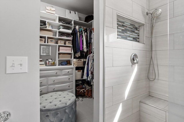 15 Longwood Dr, Youngsville, NC 27596 - bathroom featuring tiled shower and a spacious closet