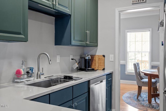 15 Longwood Dr, Youngsville, NC 27596 - kitchen featuring a sink, light countertops, wood finished floors, and dishwasher