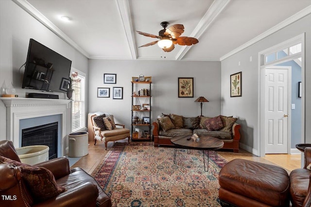 15 Longwood Dr, Youngsville, NC 27596 - living area with beamed ceiling, crown molding, baseboards, a fireplace, and a ceiling fan