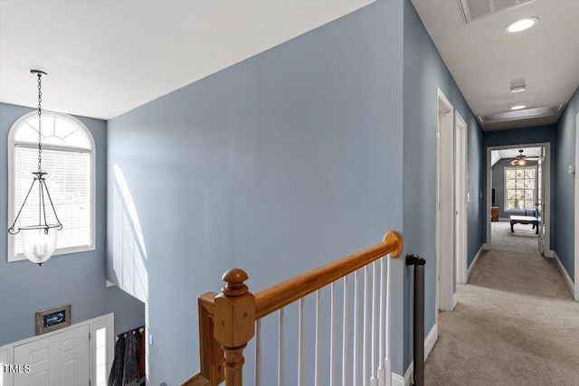 15 Longwood Dr, Youngsville, NC 27596 - corridor with an upstairs landing, baseboards, light colored carpet, and visible vents