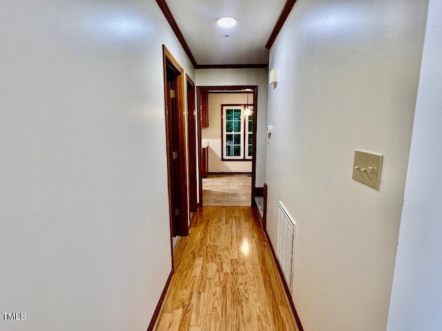 1401 Roy Averette Dr, Raleigh, NC 27603 - hallway featuring light wood-style floors and crown molding