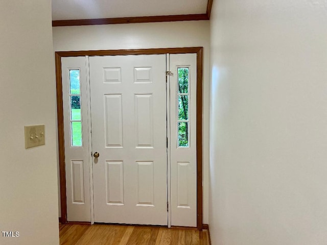 1401 Roy Averette Dr, Raleigh, NC 27603 - foyer with light wood-style floors and ornamental molding
