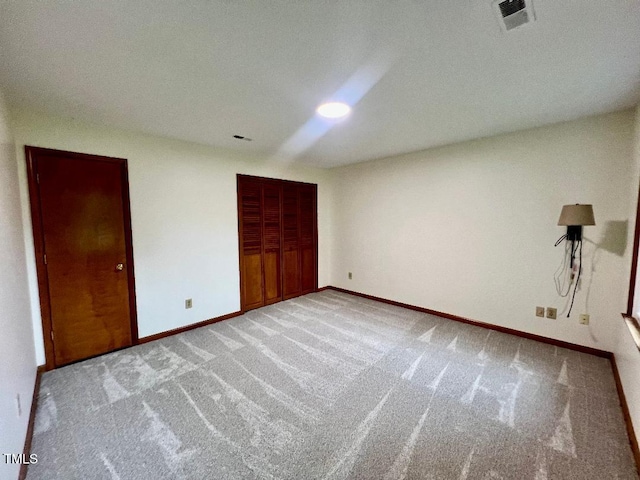 1401 Roy Averette Dr, Raleigh, NC 27603 - unfurnished bedroom featuring carpet flooring and a closet