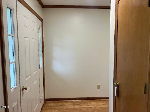 1401 Roy Averette Dr, Raleigh, NC 27603 - corridor with light wood finished floors and crown molding