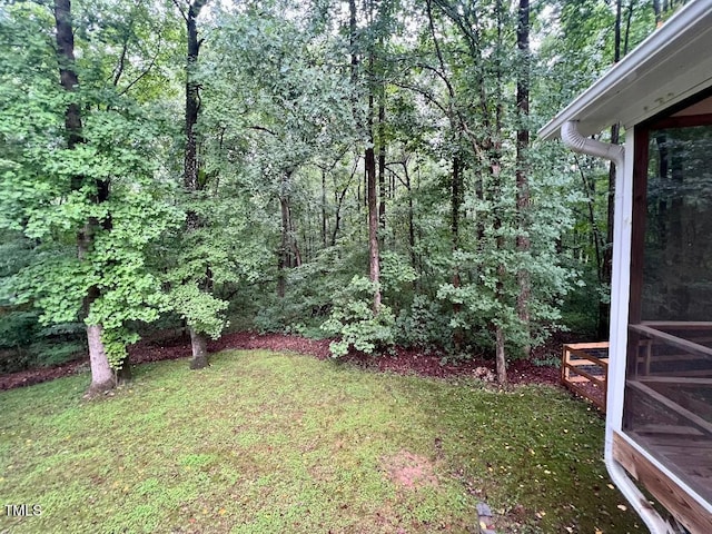 1401 Roy Averette Dr, Raleigh, NC 27603 - view of grassy yard with a view of trees