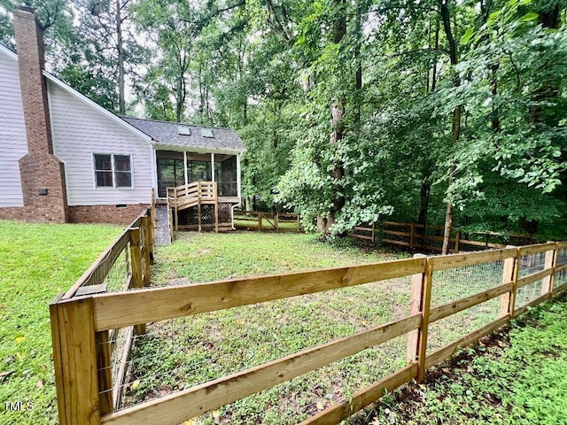 1401 Roy Averette Dr, Raleigh, NC 27603 - fenced yard with a sunroom