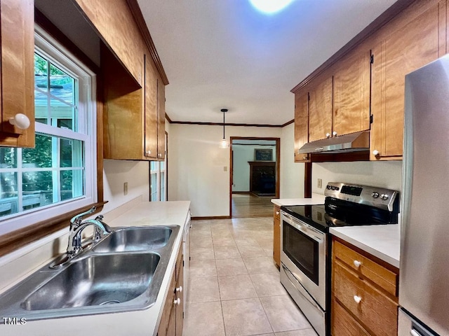 1401 Roy Averette Dr, Raleigh, NC 27603 - kitchen with stainless steel appliances, under cabinet range hood, ornamental molding, light tile patterned floors, and light countertops