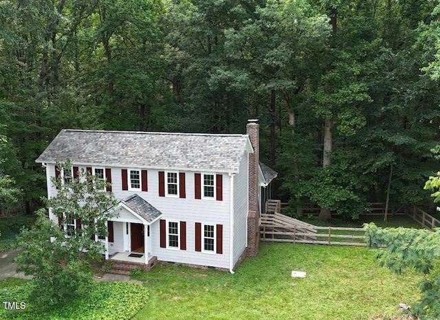 1401 Roy Averette Dr, Raleigh, NC 27603 - colonial home featuring a chimney and a view of trees
