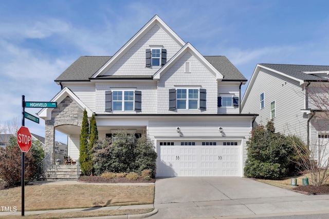 view of front of home with a garage and driveway