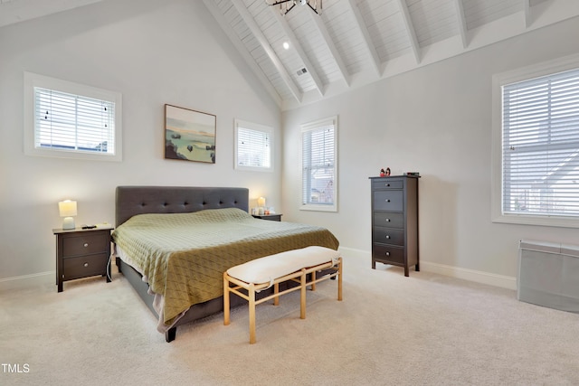bedroom featuring baseboards, light colored carpet, wooden ceiling, and beamed ceiling