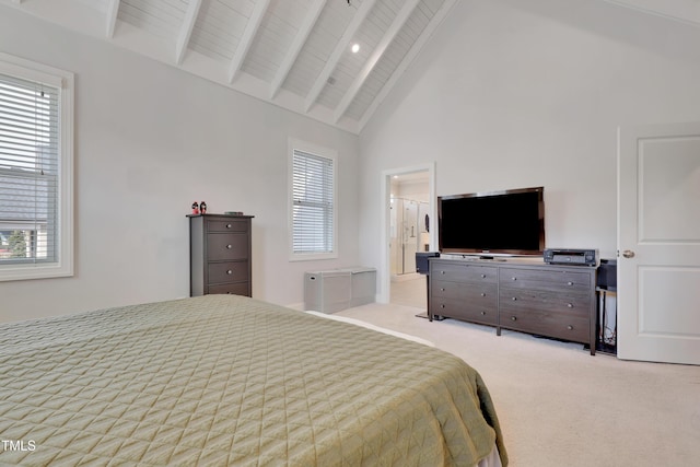 bedroom featuring carpet floors, high vaulted ceiling, and beam ceiling