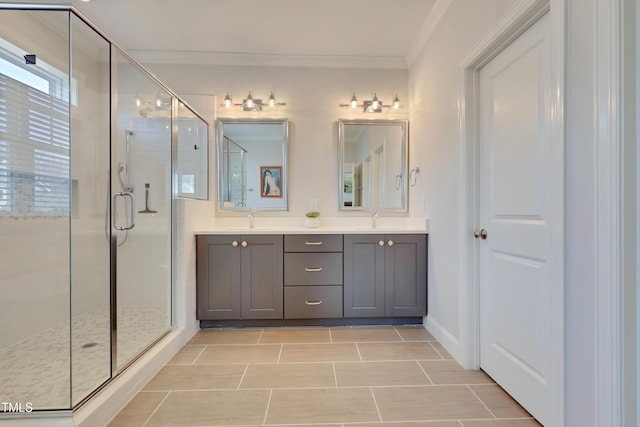 bathroom featuring a sink, ornamental molding, a shower stall, and double vanity