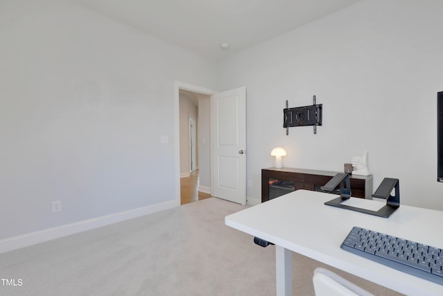 office space featuring carpet floors and baseboards