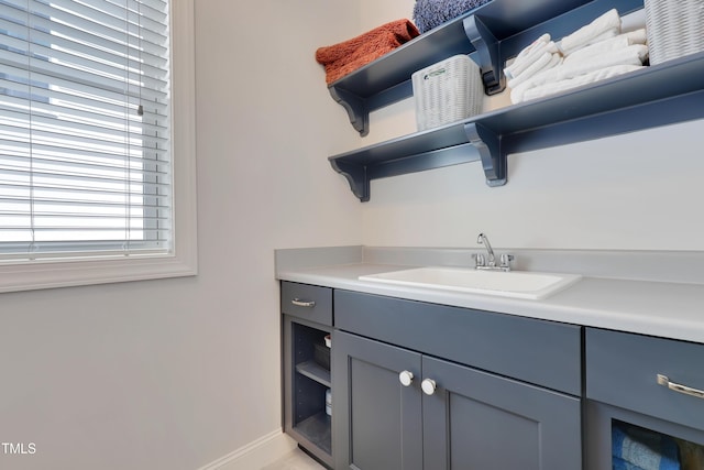 bathroom with vanity and baseboards