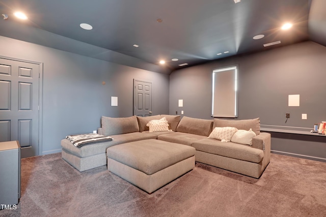 carpeted home theater room featuring baseboards, recessed lighting, and lofted ceiling