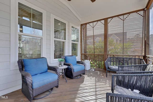 sunroom / solarium featuring ceiling fan and a wealth of natural light