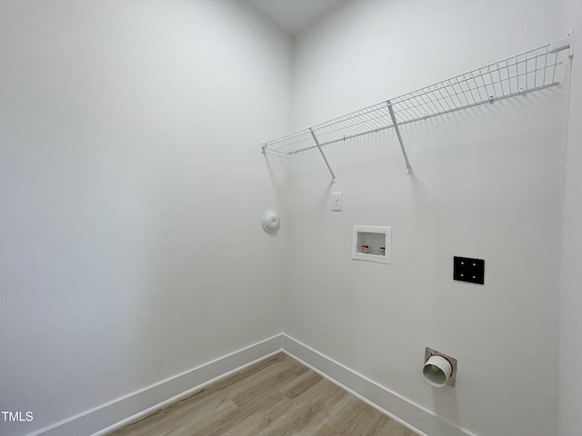 112 Remington Woods Dr, Wake Forest, NC 27587 - laundry room with washer hookup, baseboards, light wood-type flooring, and hookup for a gas dryer