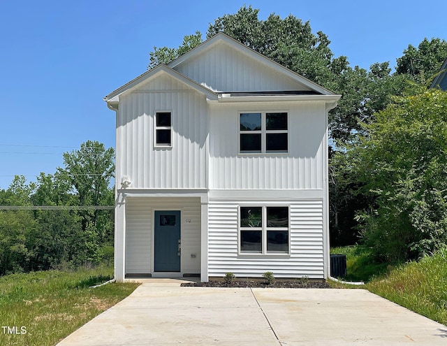 112 Remington Woods Dr, Wake Forest, NC 27587 - view of front of house with board and batten siding and cooling unit