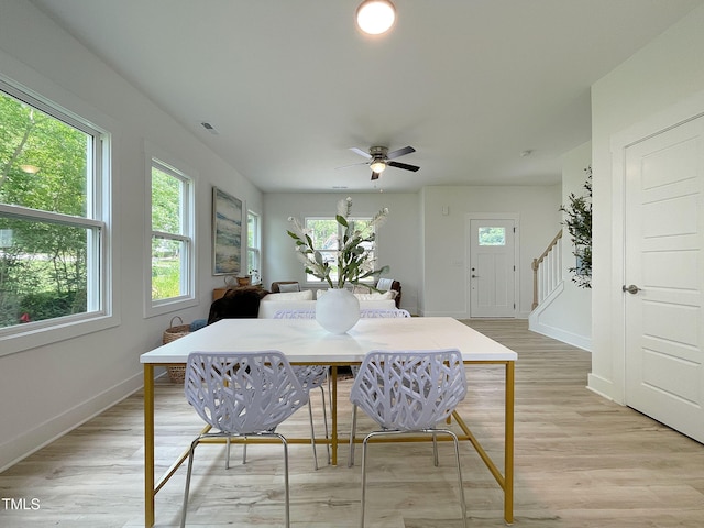 112 Remington Woods Dr, Wake Forest, NC 27587 - dining space featuring stairs, baseboards, light wood-style flooring, and ceiling fan