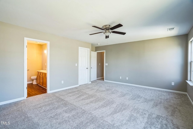 3316 Perkins Ridge Rd, Raleigh, NC 27610 - unfurnished bedroom featuring carpet, baseboards, connected bathroom, and ceiling fan