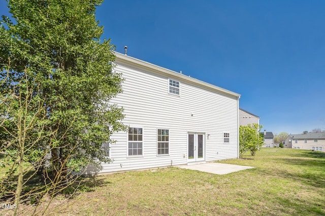 3316 Perkins Ridge Rd, Raleigh, NC 27610 - rear view of house featuring a yard and french doors