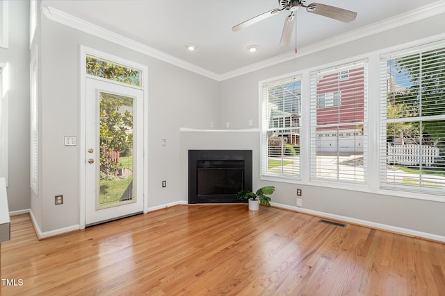 440 Heritage Village Ln, Apex, NC 27502 - unfurnished living room featuring light wood-style flooring, ornamental molding, a fireplace, and ceiling fan