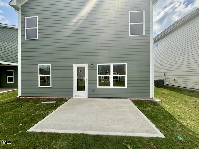 76 Commons Cir, Clayton, NC 27520 - back of house with a patio area, a lawn, and central AC unit