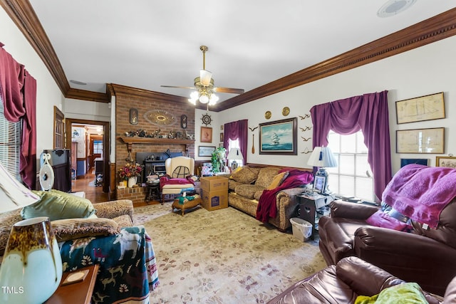 living room with a ceiling fan, a brick fireplace, and ornamental molding