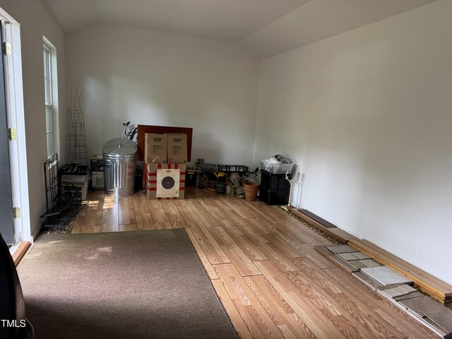 8508 Kayenta Ct, Wake Forest, NC 27587 - empty room with vaulted ceiling and wood finished floors