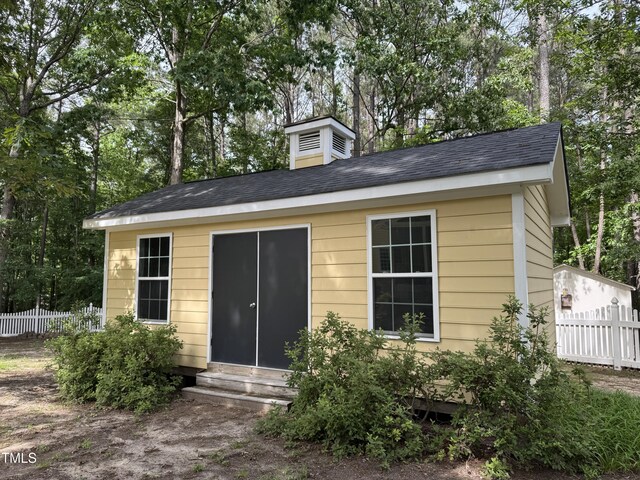 8508 Kayenta Ct, Wake Forest, NC 27587 - view of outbuilding with entry steps and view of scattered trees